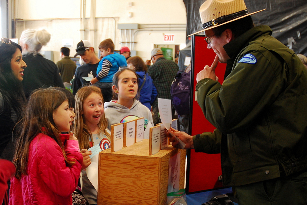Park Ranger Todd Eggert quizzes children at the California Duck Days event.