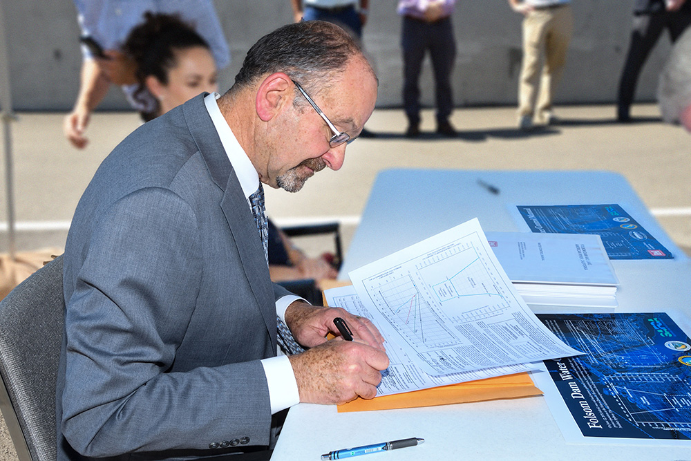 Regional Director Ernest Conant signs Folsom Dam Water Control Manual June 12, 2019. (Reclamation photos by Winetta Owens)