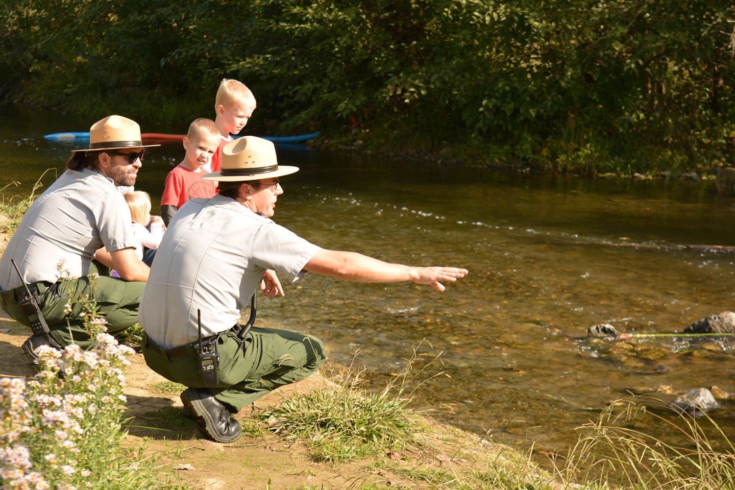 Park rangers teach children visiting the Winters Salmon Festival about Putah Creek