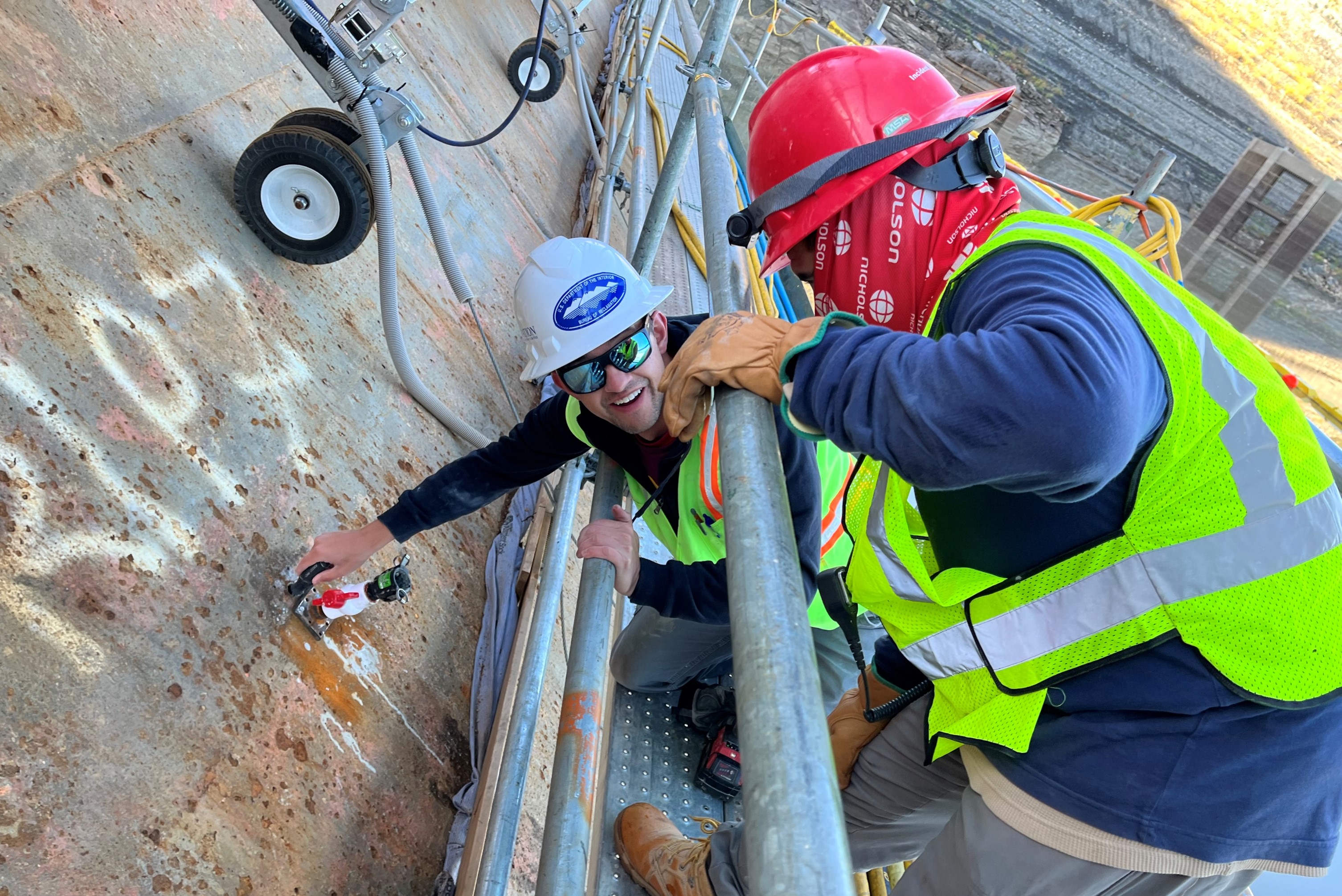 Staff Sampling Concrete on Dam Face