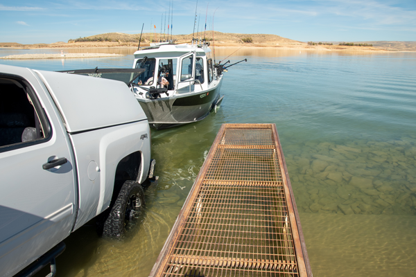 A boat owner pulls his fishing boat out of Flaming Gorge Reservoir at Anvil Draw boat ramp after a successful day of fishing, October 6, 2022.