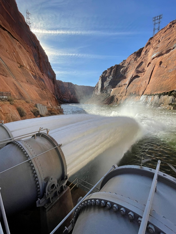 River Outlet Works during a High-flow Experiment spraying water across the Colorado River below Glen Canyon Dam