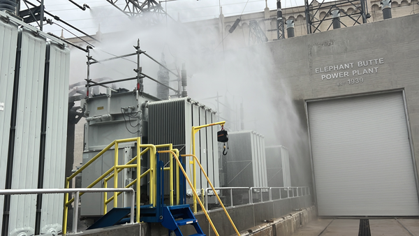 fire suppression sprinklers spraying water over a transformer bank outside the Elephant Butte Powerplant