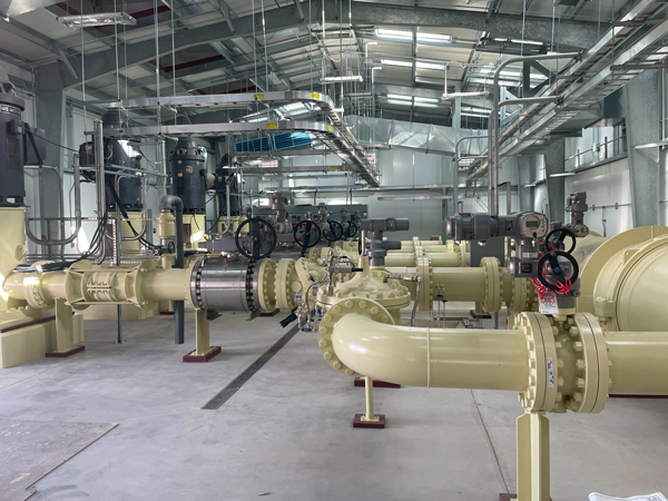 Pumping plant interior showing the extensive steel pipeworks that make up the discharge manifold